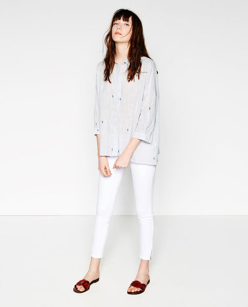 MID-RISE ZIPPED HEM JEANS